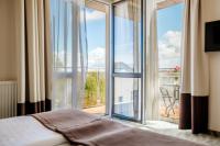 Posteľ alebo postele v izbe v ubytovaní Hotel Emocja SPA