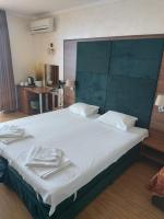 A bed or beds in a room at Guest House Skalite