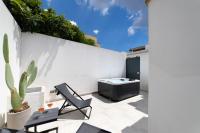 A television and/or entertainment centre at Nara Apartments 1 - Private Jacuzzi