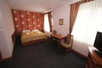 Łóżko lub łóżka w pokoju w obiekcie Hotel Vega