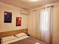 Posteľ alebo postele v izbe v ubytovaní Corfu Glyfada Beach Apartment 22
