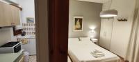 A bed or beds in a room at Papadioti Apartments
