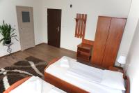 Łóżko lub łóżka w pokoju w obiekcie Hotel Vega