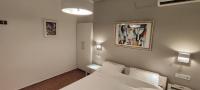 A bed or beds in a room at Papadioti Apartments