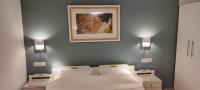 A bed or beds in a room at Papadioti Apartments