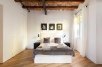Postel nebo postele na pokoji v ubytování Enjoy Apartments La Riera One