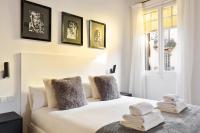 Postel nebo postele na pokoji v ubytování Enjoy Apartments La Riera One