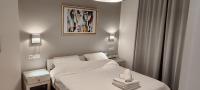 A bed or beds in a room at Papadioti Apartments