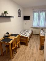 Łóżko lub łóżka w pokoju w obiekcie Pokoje gościnne Kozica