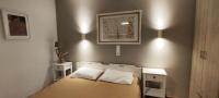 A bed or beds in a room at Papadioti Apartments