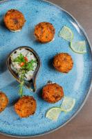 a plate of food with a bowl of rice andilantro at Mercure Belem Boulevard in Belém