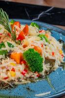 a blue plate of food with rice and vegetables at Mercure Belem Boulevard in Belém