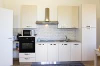Kuchyňa alebo kuchynka v ubytovaní Appartamento in villa Ariel