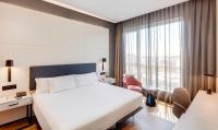 A bed or beds in a room at Sercotel Sorolla Palace