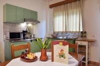 A kitchen or kitchenette at Sissy Village All Suite Hotel