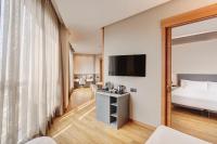 A bed or beds in a room at Sercotel Sorolla Palace