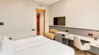 A bed or beds in a room at Sercotel Sorolla Palace
