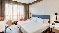 A bed or beds in a room at Sercotel Sorolla Palace