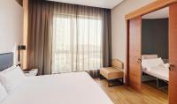 A bed or beds in a room at Sercotel Sorolla Palace