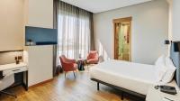A television and/or entertainment centre at Sercotel Sorolla Palace