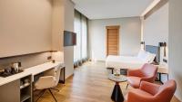 A television and/or entertainment centre at Sercotel Sorolla Palace