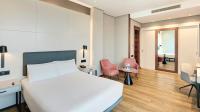 A bed or beds in a room at Sercotel Sorolla Palace
