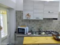 Kuchyňa alebo kuchynka v ubytovaní Casa vacanze su sorighe.