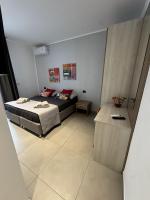 A bed or beds in a room at SOLUS B&B