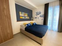 A bed or beds in a room at SOLUS B&B