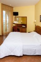 A bed or beds in a room at Hotel Audi Frontemare