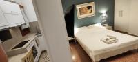 A bed or beds in a room at Papadioti Apartments