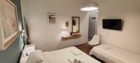 A bed or beds in a room at Papadioti Apartments