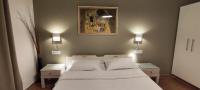 A bed or beds in a room at Papadioti Apartments