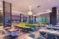 an image of a restaurant with tables and chairs at Queensland Hotel Bangkok in Bangkok