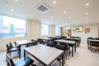 a dining room with tables and chairs at BrownDot Hotel Hongseong Naepo in Hongseong