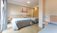 Posteľ alebo postele v izbe v ubytovaní Hotel Olympia Ronda I