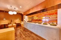 a kitchen with a counter in a restaurant at remm Kagoshima in Kagoshima