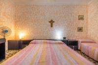 A bed or beds in a room at Casa vacanza Elena