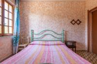A bed or beds in a room at Casa vacanza Elena