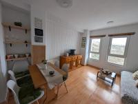 Televízia a/alebo spoločenská miestnosť v ubytovaní Apartamento Ginebra Sierra Nevada