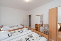 Posteľ alebo postele v izbe v ubytovaní Apartment Slava