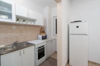 Kuchyňa alebo kuchynka v ubytovaní Apartment Slava