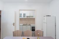 Kuchyňa alebo kuchynka v ubytovaní Apartment Slava