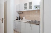 Kuchyňa alebo kuchynka v ubytovaní Apartment Slava