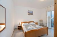 Posteľ alebo postele v izbe v ubytovaní Apartment Slava