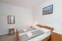 Posteľ alebo postele v izbe v ubytovaní Apartment Slava