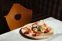 a plate of food sitting on top of a table at Stella Due in Arabba