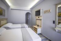 A bed or beds in a room at Carpe Diem Rooms Nei Pori