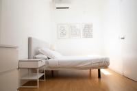 A bed or beds in a room at ÁTICO CENTRO HISTÓRICO MADRID