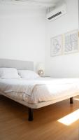 A bed or beds in a room at ÁTICO CENTRO HISTÓRICO MADRID